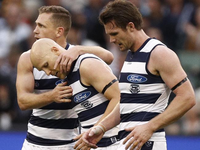 Gary Ablett of the Cats (centre) celebrates a goal with Joel Selwood (left) and Patrick Dangerfield during the Round 5 AFL match between the Hawthorn Hawks and the Geelong Cats at the MCG in Melbourne, Monday, April 22, 2019. (AAP Image/Daniel Pockett) NO ARCHIVING, EDITORIAL USE ONLY