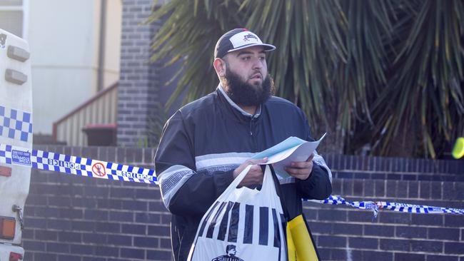 A man who said he was the son of Lametta Fadlallah leaves her home on Sunday. Picture: Liam Mendes