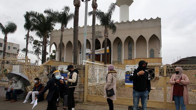 People queue outside Lakemba Mosque to attend a pop-up vaccine clinic at the Lebanese Muslim Association ]on August 8 in Sydney. Picture: Getty