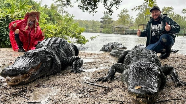 Gatorland’s Savannah Boan, in red, says none of the Orlando wildlife park’s alligators and crocodiles have escaped during its 75-year history. Picture: Savannah Boan/WSJ