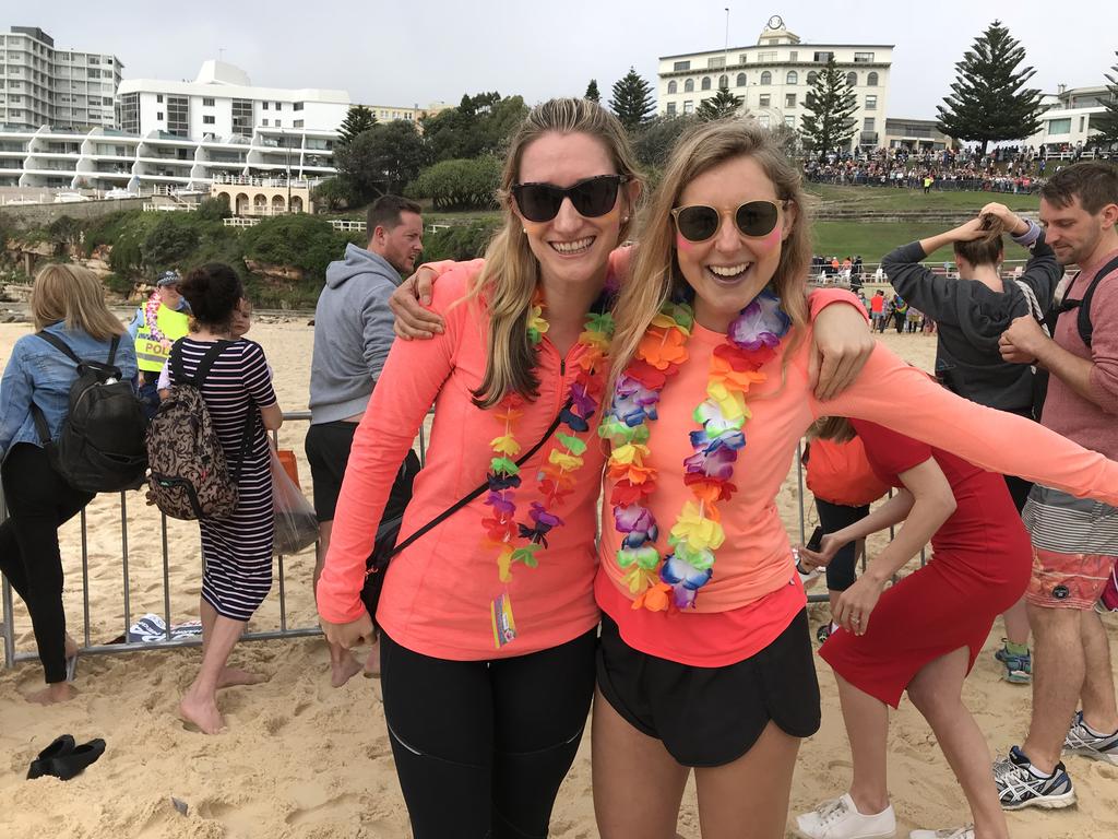 Bridget Slipper, 33, and Hermione Davis, 34, came down to the beach at 6am and they say it was ‘worth the wait’ to get a quick handshake from Meghan. Picture: James Weir