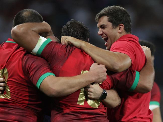 Portugal's flanker Manuel Picao (R) celebrates with teammates after victory in the France 2023 Rugby World Cup Pool C match between Fiji and Portugal at the Stade de Toulouse in Toulouse, southwestern France on October 8, 2023. (Photo by Valentine CHAPUIS / AFP)