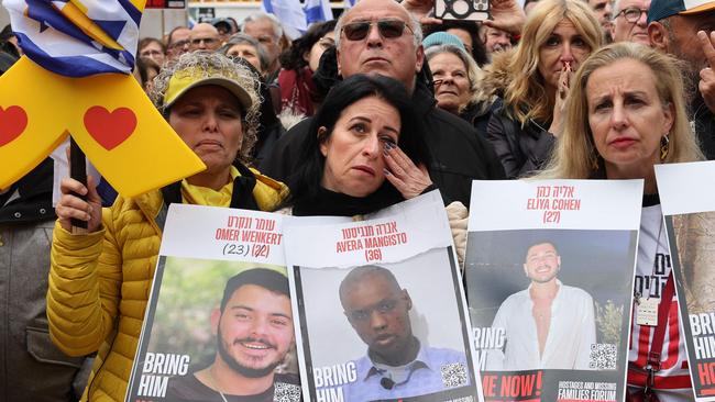 A woman reacts as people gather at 'Hostages Square' in Tel Aviv, to watch the release of Israeli hostages. Picture: AFP