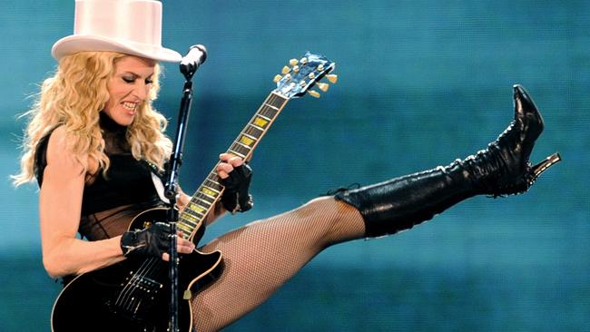 Bad Girl ... Feel free to leave the guitar at home on this tour Madge. Picture: AFP