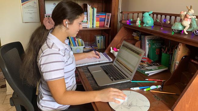 St Rita's College student Eva Naidoo using the college's Learning At Home Program.