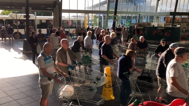 Coronavirus: Elderly shoppers queue in Brisbane