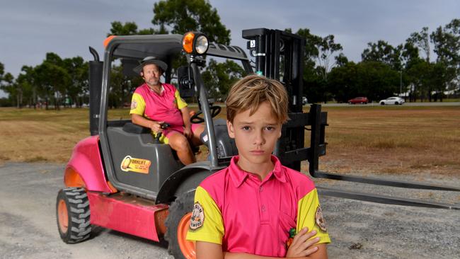 Brent Stevenson with his son Klay, 10, and one of his transport business's forklifts. Picture: Evan Morgan