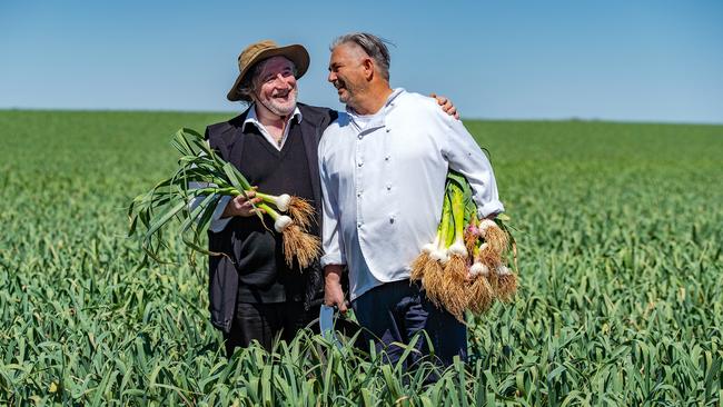 Not easy: Australian Garlic Producers director Nick Diamantopoulos and restaurateur Stefano de Pieri in garlic fields outside Mildura.