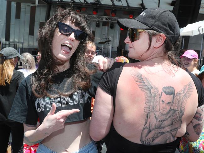 Elle Haywood and Hazel Leech wait for Williams at Fed Square. Picture: David Crosling