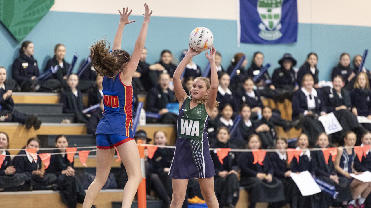 Zoe Giles (right) of St Ursula's Junior Development against Downlands Junior C in Merici-Chevalier Cup netball at Salo Centre, Friday, July 19, 2024. Picture: Kevin Farmer