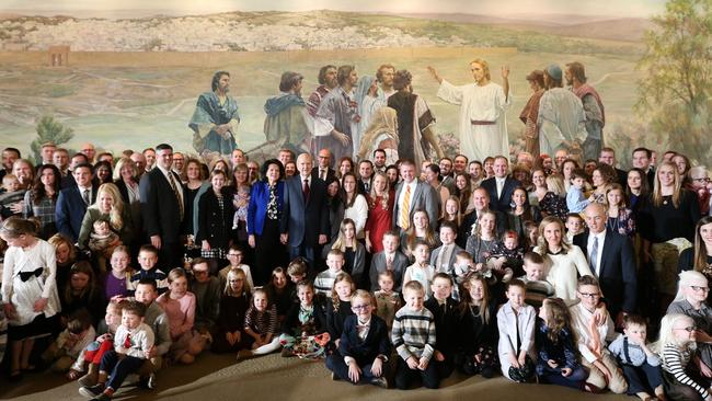 Church of Jesus Christ of Latter -Day Saints president Russell M. Nelson (centre-left) with his wife Wendy (in blue coat) and family members in 2017. Picture: George Frey/Getty Images