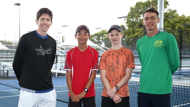 The Cairns International Tennis Centre has officially reopened with a roof now covering centre court. John-Patrick Smith and John Millman pose for a photo with Cairns tennis juniors Taichii Sato and Bailey Horn from the Edge Hill Tennis Club. PICTURE: BRENDAN RADKE