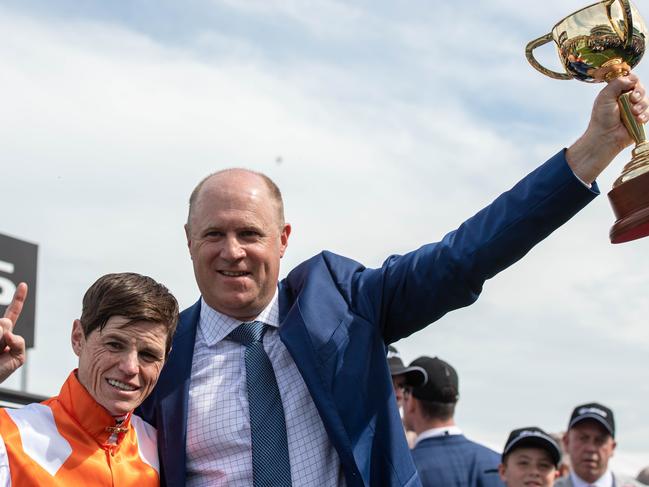Trainer Danny O’Brien and jockey Craig Williams celebrate with the Melbourne Cup on Tuesday. Picture: Jason Edwards