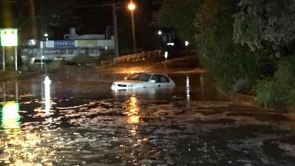 Wayne Whiting pulled two terrified people from this car after floodwaters swamped Lenah Valley Rd.