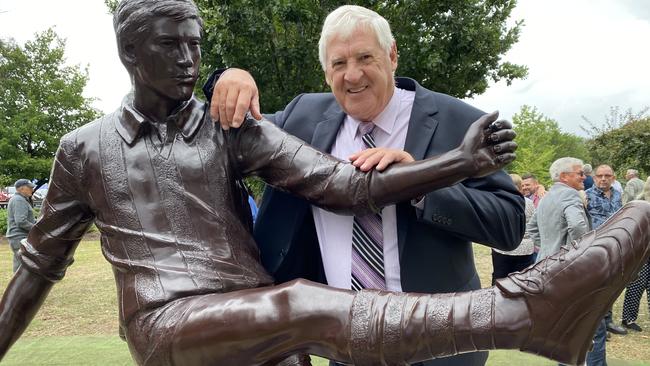 Tasmanian footy legend Peter Hudson with the statue unveiled in his honour today in the town where it all started – New Norfolk. Picture: James Bresnehan