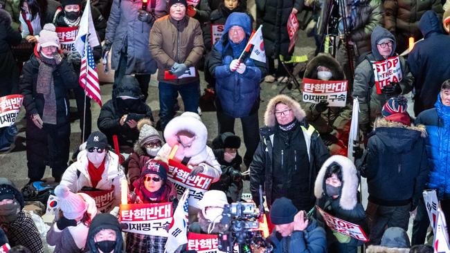 Supporters of impeached South Korea president Yoon Suk Yeol rally near his residence in Seoul. Picture: AFP.