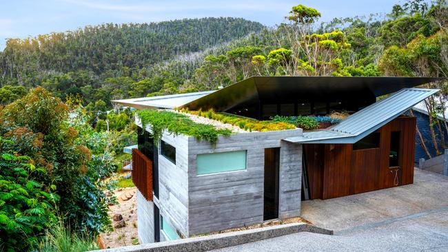 A rooftop garden helps the house fit into the coastal landscape.