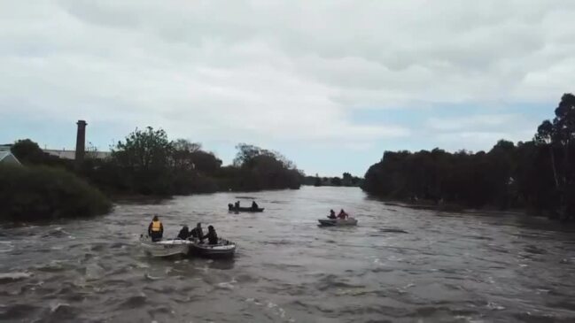 Boaties in flooded Barwon River in Geelong