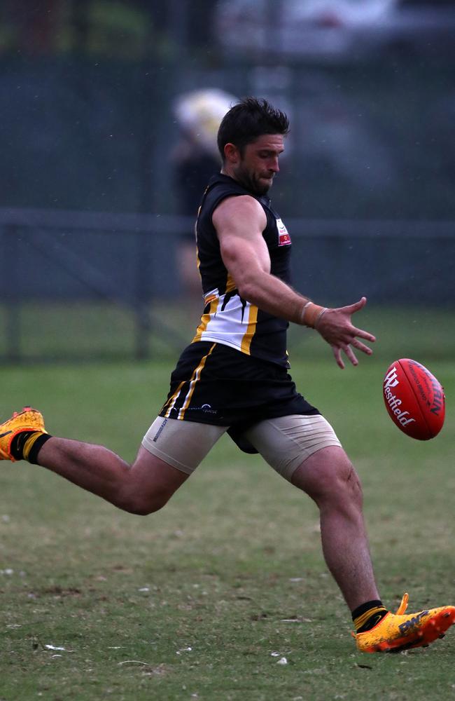 Kris Pendlebury throws his boot at the ball. Picture: Mark Dadswell.