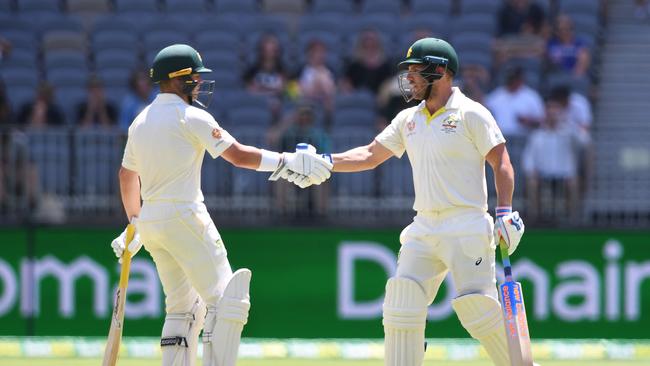 Aaron Finch shakes hands with Harris after reaching a 100 run partnership. (AAP Image/Dave Hunt) 