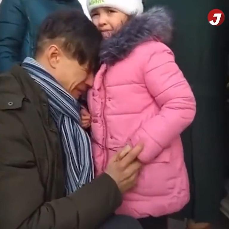 A brave dad sobs as he says goodbye to his departing daughter and partner before staying to defend Ukraine from the Russians. Picture: