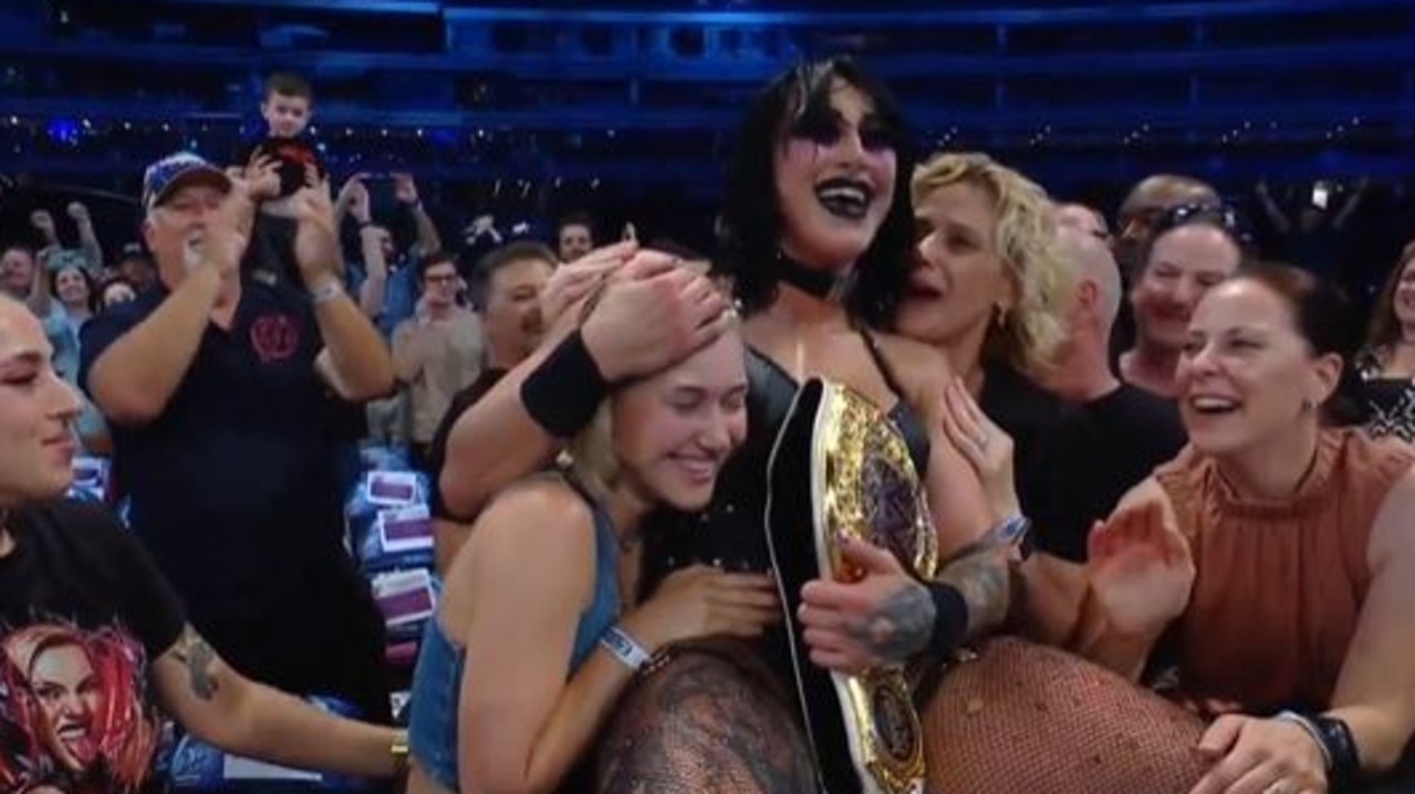 Ripley ran over to her family after the win. Picture: Twitter, @WWE