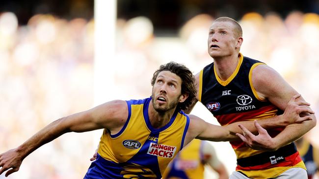 Tom Hickey of the Eagles contests a throw-in with Sam Jacobs of the Crows. Picture: Getty Images