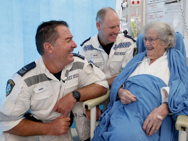 Mary McDonough, 93, is reunited with senior constables Ben King and Adam Davis, who helped extract her from her South Lismore home on a boogie board during the floods. Picture: Toby Zerna