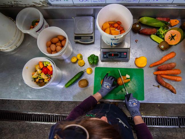 Georgie Greig prepares some healthy food for the animals. Picture: Jason Edwards