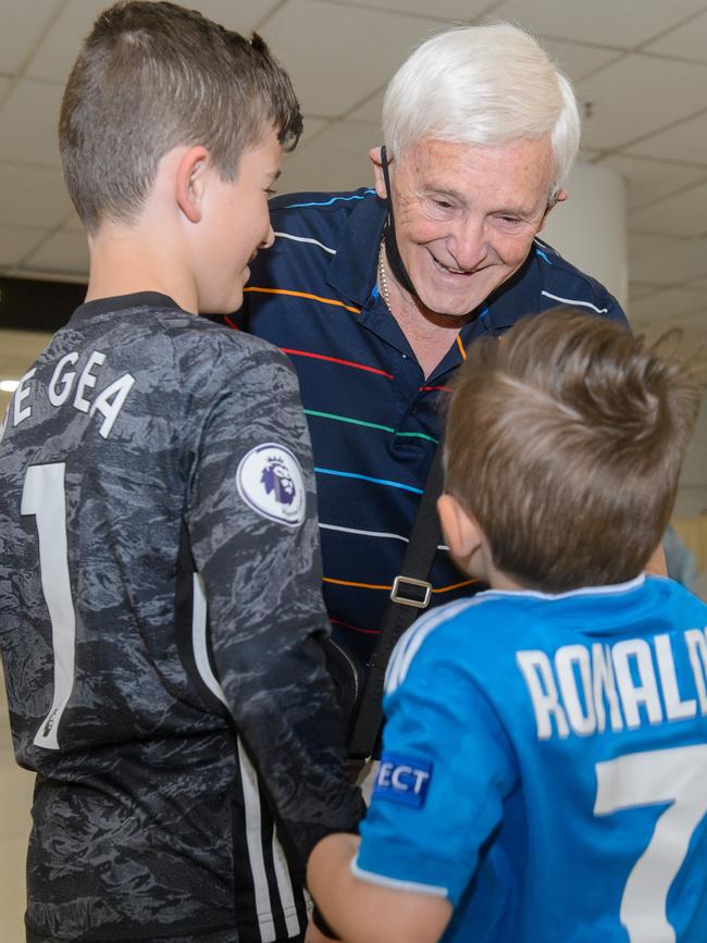 Dion and Levi welcoming their grandfather Paul Battistella. Picture: Jay Town