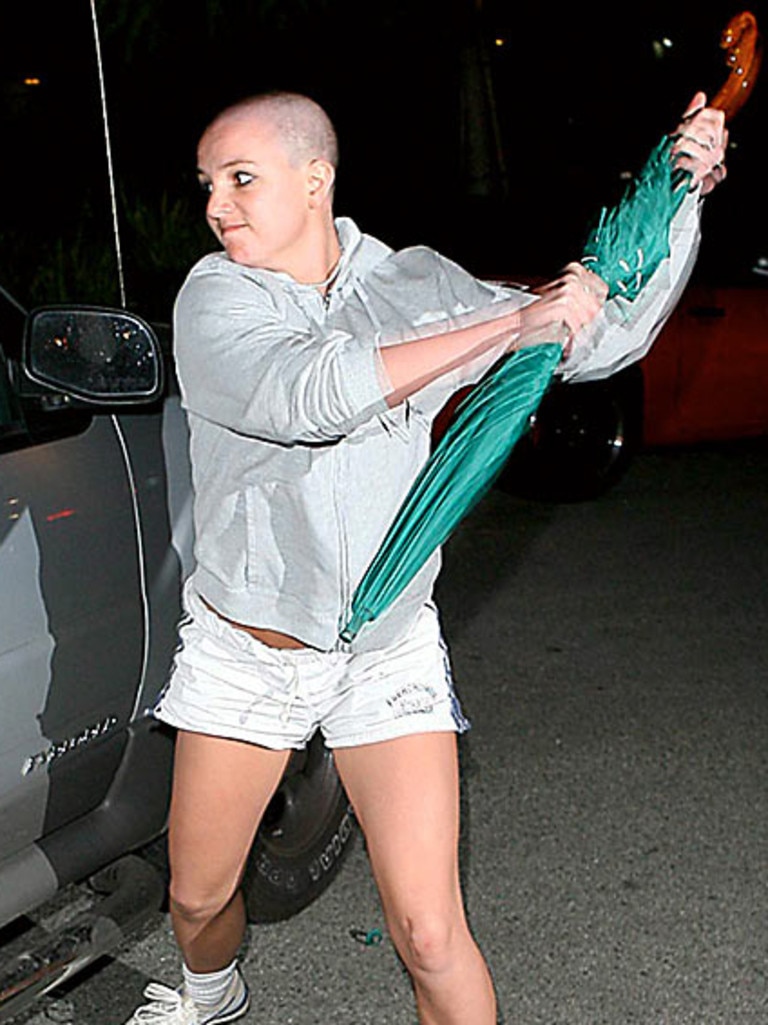 Spears attacking paparrazo's car with umbrella. Picture: X17online