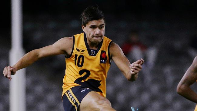 Nab AFL under 18 Championships at Etihad Stadium, Vic Country v WA. Melbourne. Jarrod Pickett gets a kick away as Jarrod Garlett looks on.2nd July 2014. Picture : Colleen Petch.