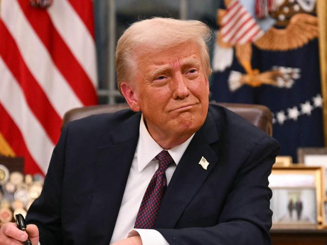 US President Donald Trump signs executive orders in the Oval Office of the White House in Washington, DC, on January 20, 2025. Picture: NewsWire / Jim WATSON / POOL / AFP