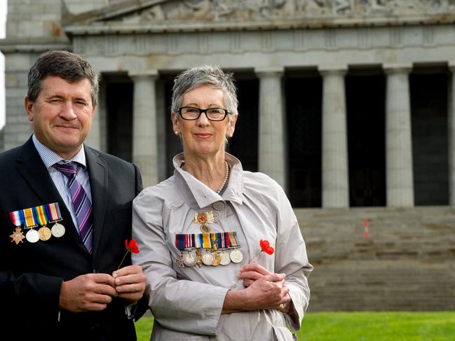 Maggie Johnson and Mark Appleford wearing their grandparents WWI medals at Shrine. Picture: Jay Town