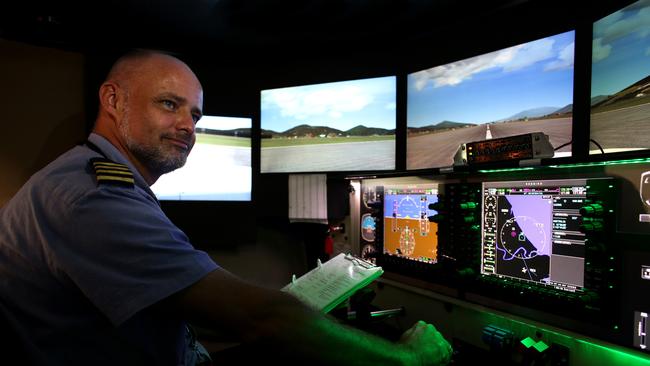 Mission Aviation Fellowship and Aviation Australia opened a new global pilot aviation training centre at Mareeba Airport, with a state of the art flight simulator being operated by flight instructor Volkher Jacobsen. Picture: Marc McCormack