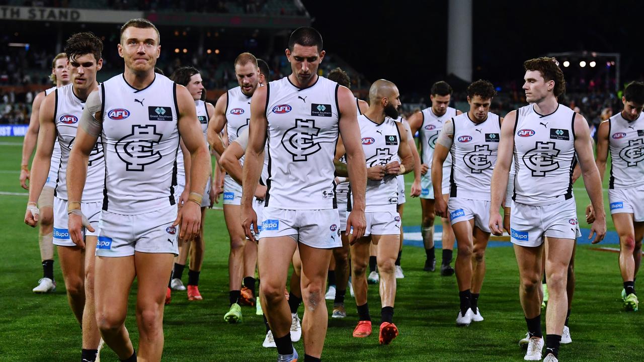 Carlton players walk off the Adelaide Oval. (Photo by Mark Brake/Getty Images)