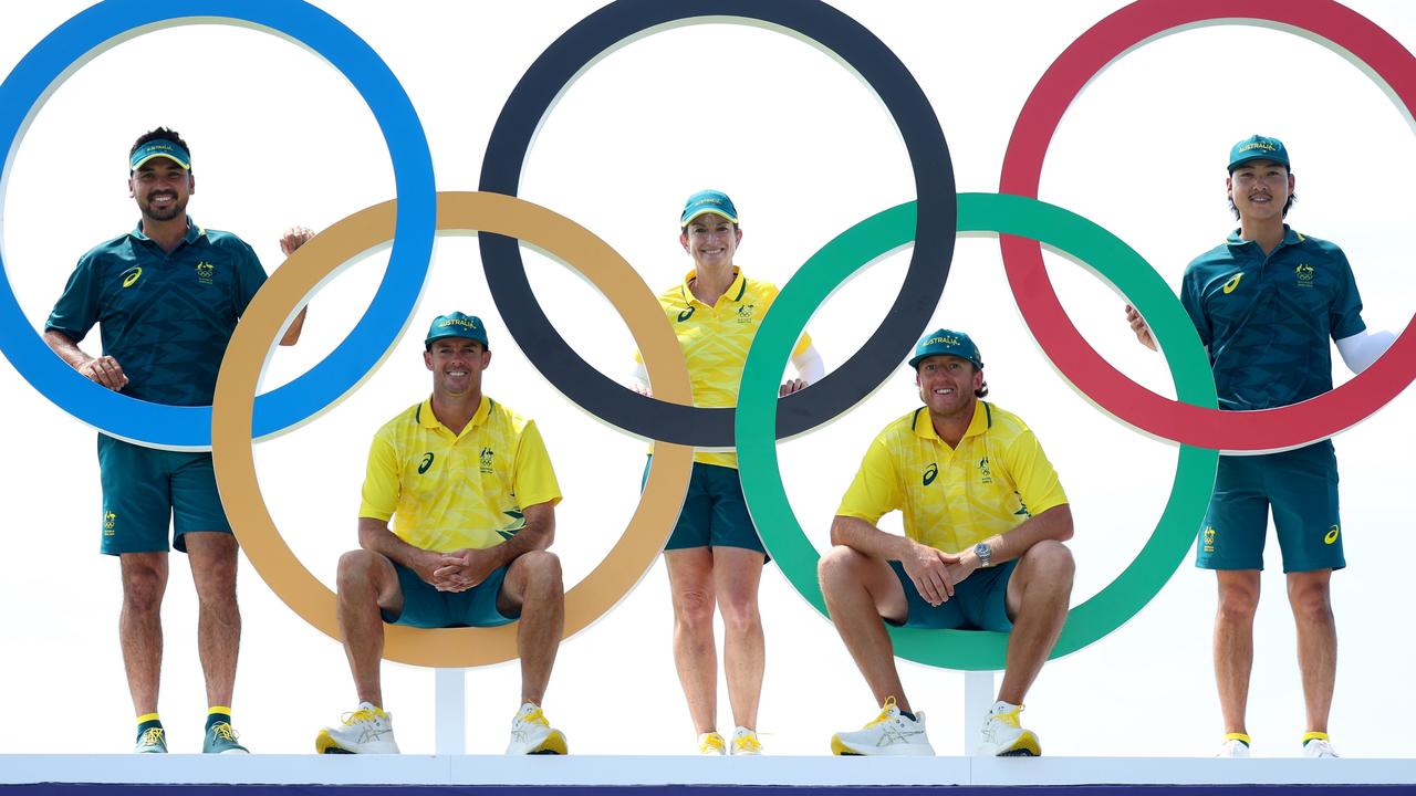 Karrie Webb with Aussie Olympians Jason Day and Min Woo Lee, and their caddies, in Paris. Picture: Andrew Redington/Getty Images