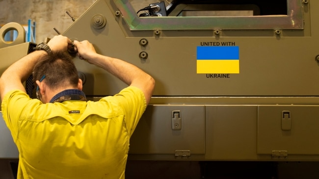 The Ukrainian flag emblazoned on the side of one of the Bushmasters bound to the warzone. Picture: Department of Defence