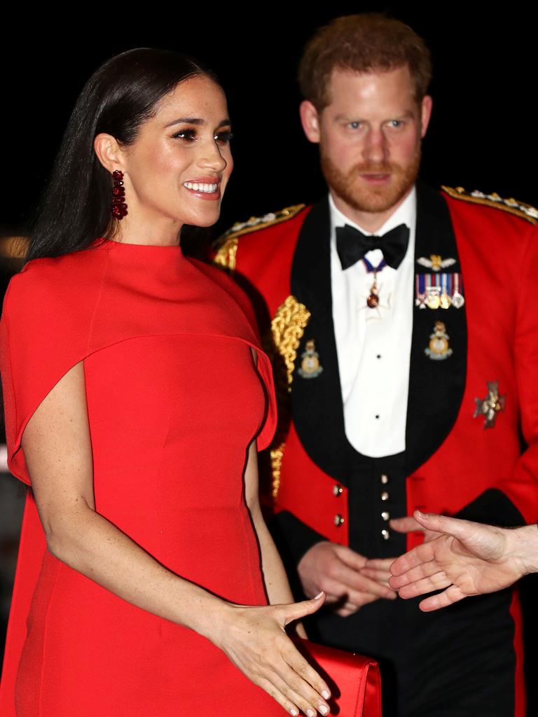 Britain's Prince Harry, Duke of Sussex and Meghan, Duchess of Sussex arrive to attend The Mountbatten Festival of Music at the Royal Albert Hall in London. Picture: SIMON DAWSON / POOL / AFP.