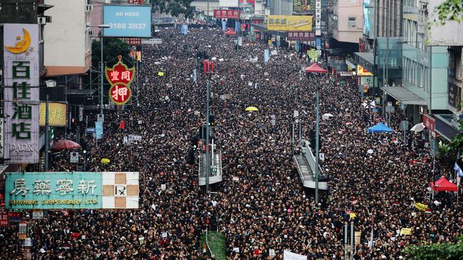 The million-strong protest winds its way through Hong Kong yesterday, made up of students, families and the elderly. Picture: Getty Images