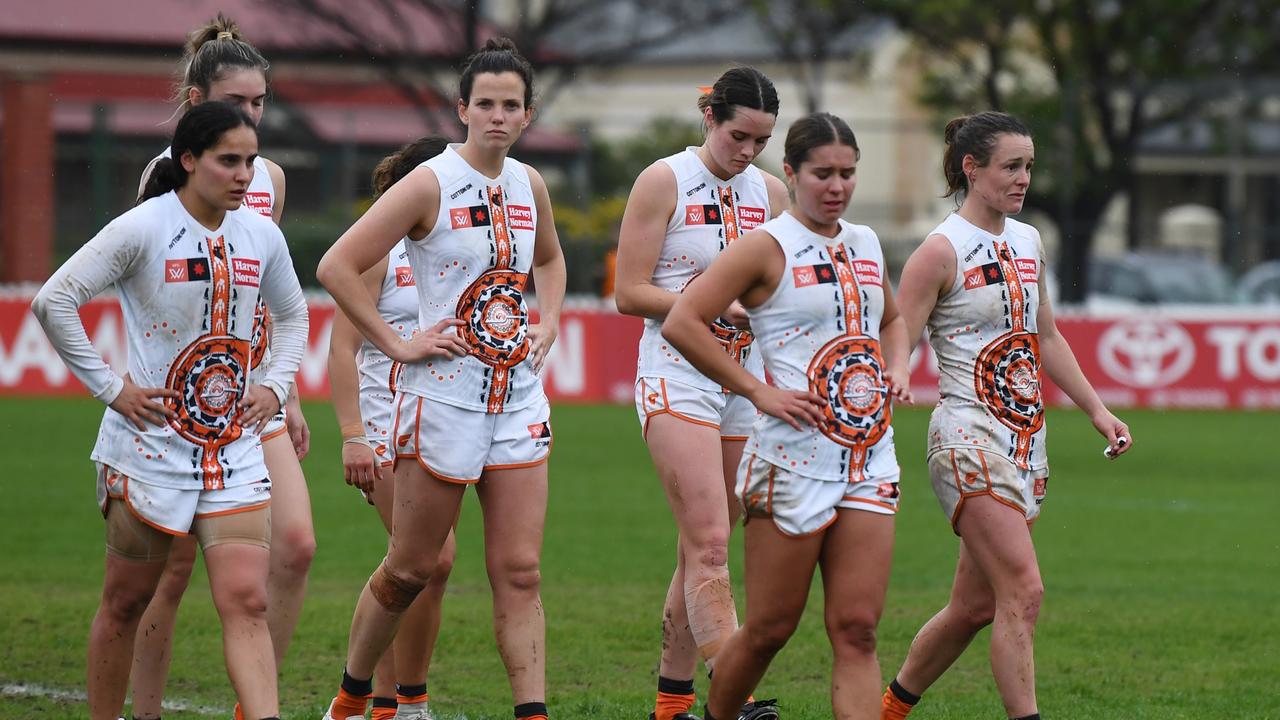 GWS players leave the field after their historic defeat. Picture: Mark Brake/Getty Images