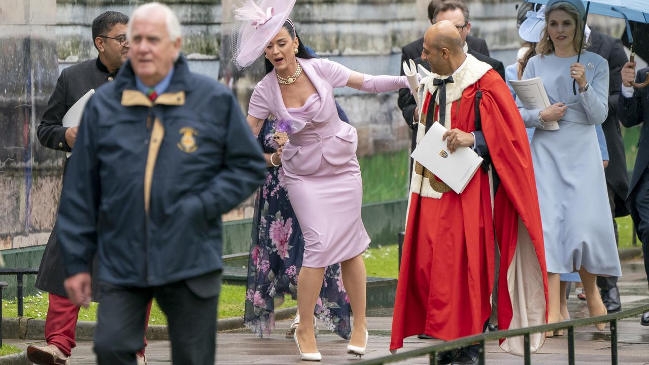 Katy Perry appears to take a bit of a stumble as she departs Westminster Abbey. Picture: WPA Pool/Getty Images