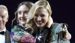 Saoirse Ronan, left, presents the Desert Palm achievement award - actress to Cate Blanchett at the 27th annual Palm Springs International Film Festival Awards Gala on Saturday, Jan. 2, 2016, in Palm Springs, Calif. (Photo by Chris Pizzello/Invision/AP)