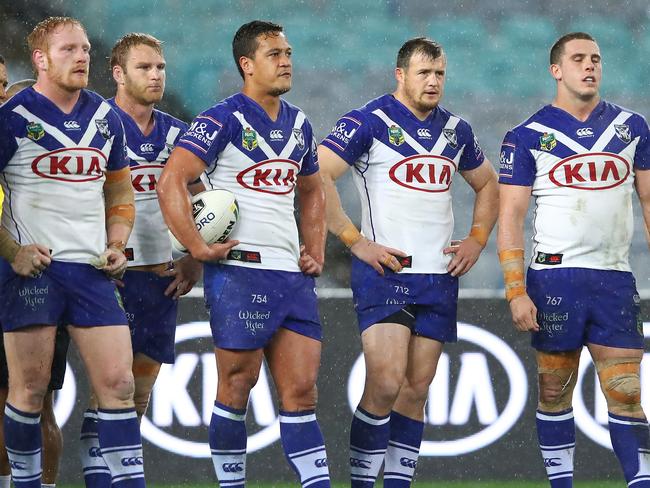 Bulldogs players look dejected after an Eels try.