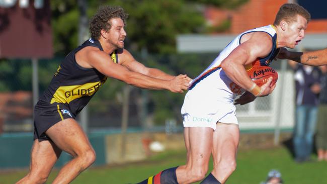 Adelaide's Reilly O'Brien breaks away from Glenelg's Matthew Snook. Picture: AAP Image/ Brenton Edwards