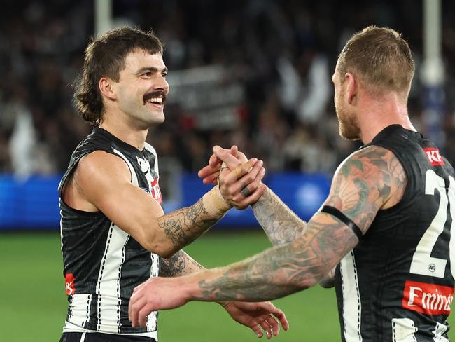 MELBOURNE, AUSTRALIA - MAY 24: Oleg Markov and Tim Membrey of the Magpies after the siren during the 2025 AFL Round 11 match between the North Melbourne Kangaroos and the Collingwood Magpies at Marvel Stadium on May 24, 2025 in Melbourne, Australia. (Photo by James Wiltshire/AFL Photos via Getty Images)