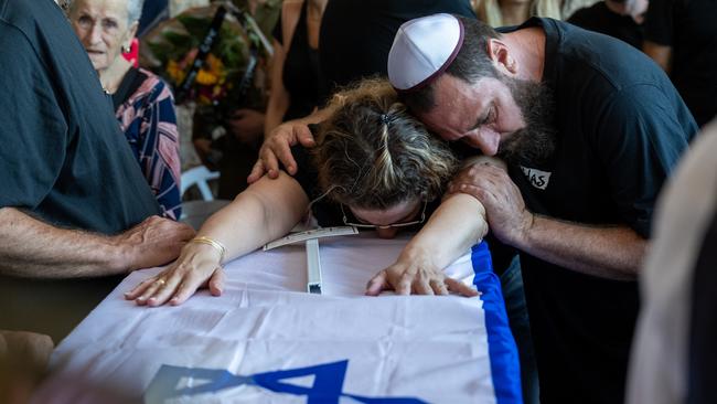 A family grieves at the Hod Ha'sharon cemetery. Picture: Getty