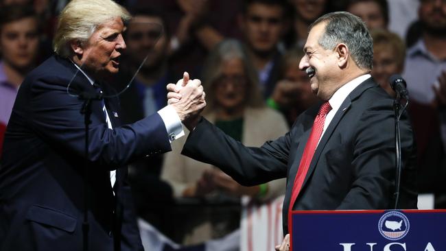 President-elect Donald Trump thanks Dow Chemical Company Chairman and Chief Executive Officer Andrew Liveris during a rally in Grand Rapids, Michigan