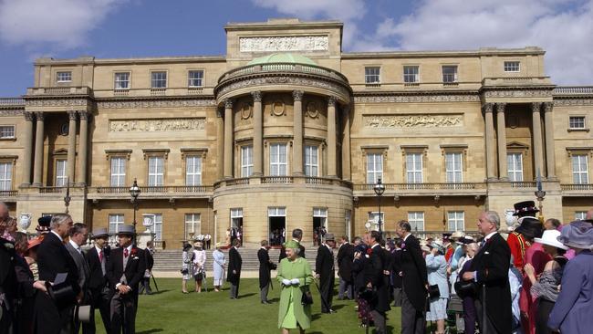 Buckingham Palace Garden Party. The Queen Meeting Guests. Gentlemen Ushers Wait To Make The Introductions. Picture: Getty Images.