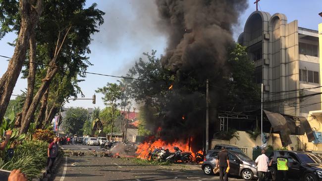 Police at the site of a blast outside the Gereja Pantekosta Pusat Surabaya (Surabaya Centre Pentecostal Church) in Surabaya. Picture: AFP